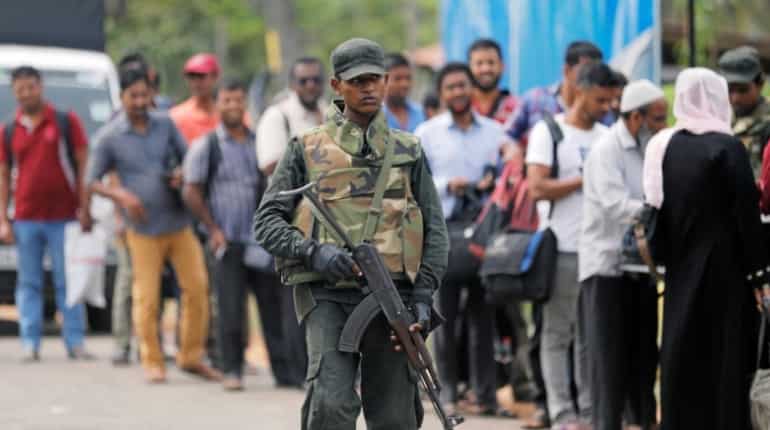 Sri Lanka imposes curfew in western coastal town after communal clashes