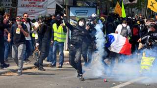 French police fire tear gas at protesters in Paris May Day rally