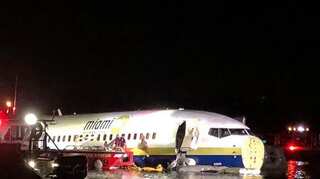 Boeing 737 slides off runway into Florida river, 21 hurt