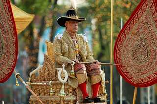 Newly crowned Thai king carried through Bangkok in royal procession