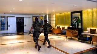 Guns outnumber guests at bombed Sri Lanka hotel