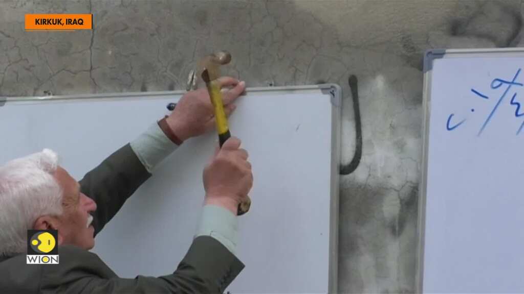 Retired Iraqi teacher brings schooling to a street in Kirkuk