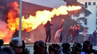 Albanian protesters hurl petrol bombs, seek snap polls