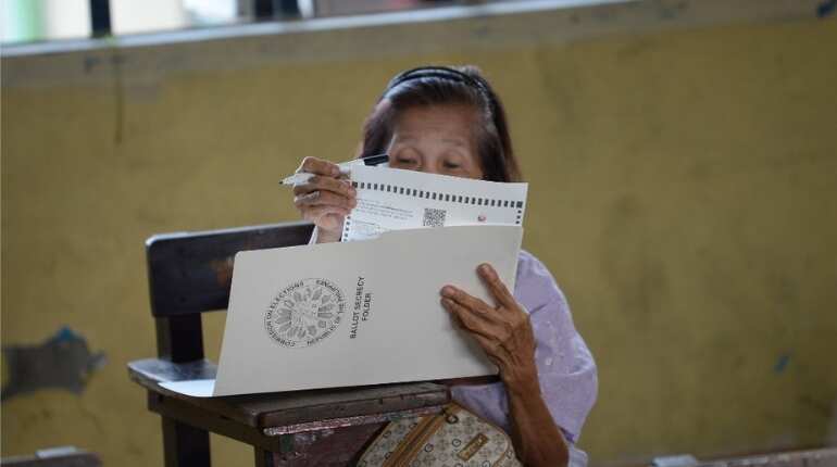 Philippines votes in polls expected to strengthen Duterte's grip on power