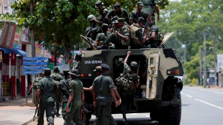 Sri Lanka soldiers patrol areas hit by violence