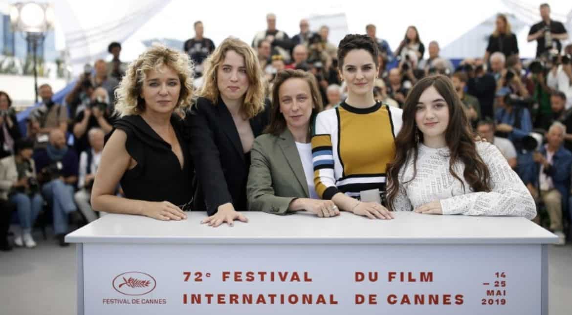Director Celine Sciamma with the film's cast members