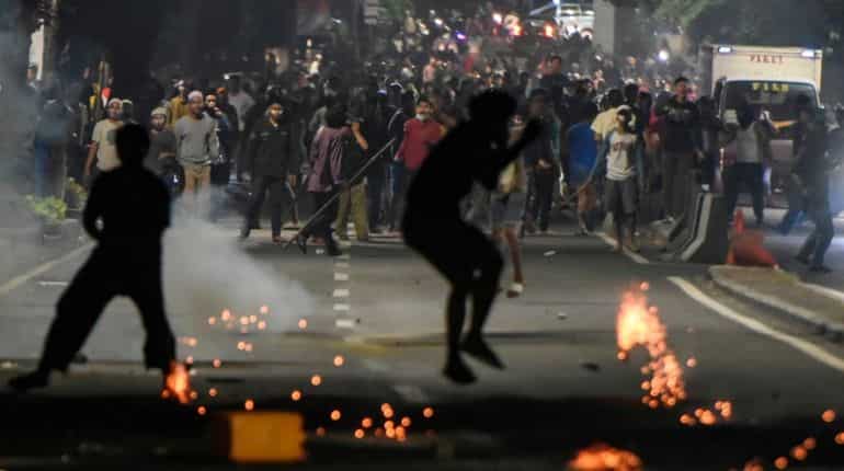 Indonesian police arrest at least 20 amid post-election violence