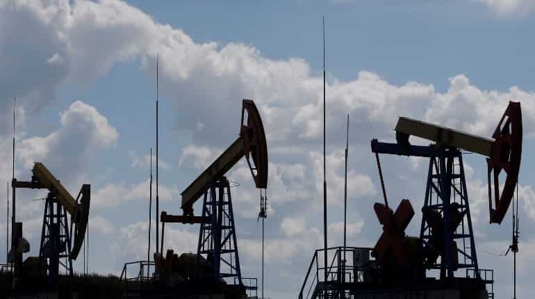 Oil prices fall on surging US crude stockpiles, economic concerns