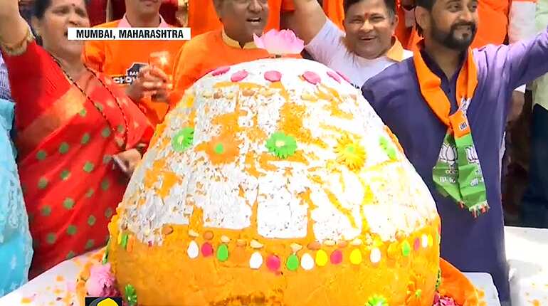 BJP party workers celebrate in West Bengal and Mumbai