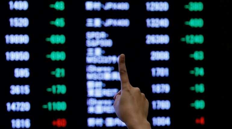 Asian shares buoyed by Wall St rally, but China worry caps gains