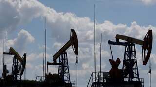Oil prices fall on surging US crude stockpiles, economic concerns