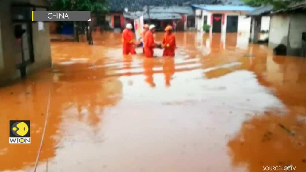Firefighters evacuate residents from rain-triggered flooding in parts of China
