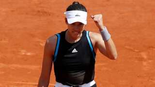 French Open: Garbine Muguruza canters into third round after defeating Johanna Larsson