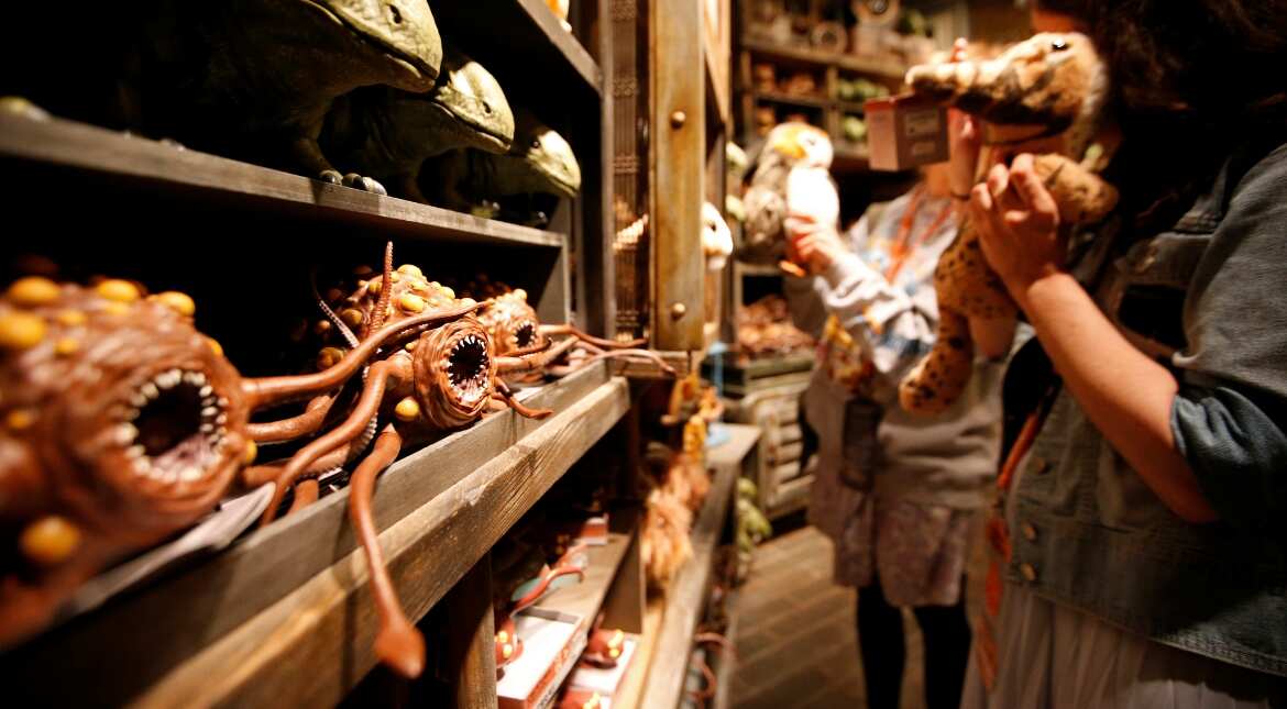 Rathtar toys are seen on a shelf as guests explore the park
