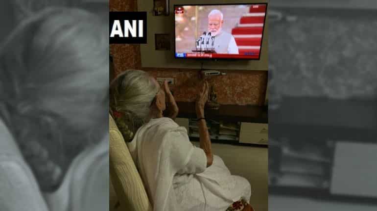 A delighted Heeraben watches son Narendra Modi take oath as PM A delighted Heeraben watches son Narendra Modi take oath as PM