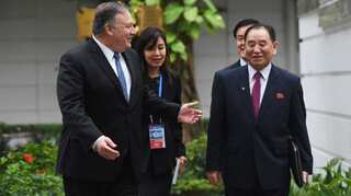 Amid execution reports, North Korea's ex-nuclear envoy seen with Kim Jong-un