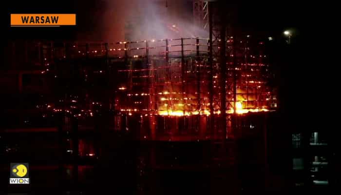 Blaze engulfs upper floors of Warsaw high-rise