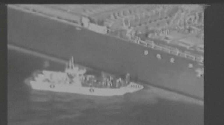 Iran's Revolutionary Guard removing an unexploded limpet mine, alleges US