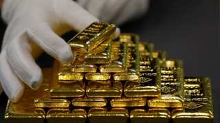 Gold prices subdued on firmer dollar; Fed meeting in focus
