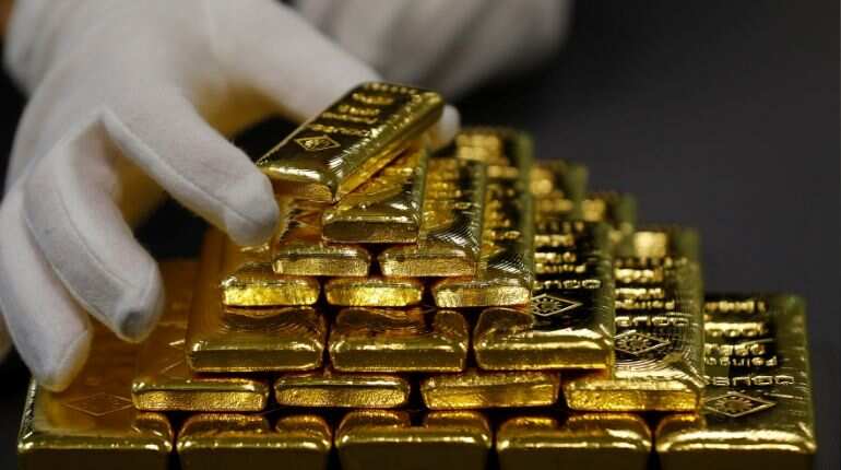 Gold prices subdued on firmer dollar; Fed meeting in focus