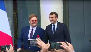 Hand-in-hand, Macron and Elton John join forces on AIDS