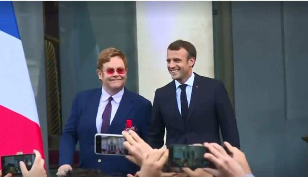 Hand-in-hand, Macron and Elton John join forces on AIDS