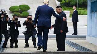 Trump becomes first sitting US president to set foot inside North Korea 