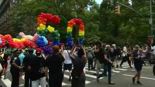 Rainbows fill New York's streets as gay pride parade celebrates 50 year anniversary of Stonewall riots