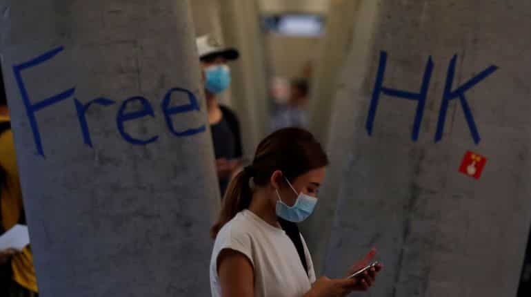 In a bid to keep up pressure on city's pro-Beijing leaders, Hong Kong protesters take aim at China station In a bid to keep up pressure on city's pro-Beijing leaders, Hong Kong protesters take aim at China station