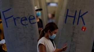 In a bid to keep up pressure on city's pro-Beijing leaders, Hong Kong protesters take aim at China station 