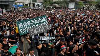 Hong Kong protesters take aim at Chinese traders