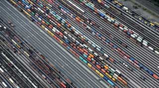 Euro zone growth, inflation outlook cut as risks from US trade grow