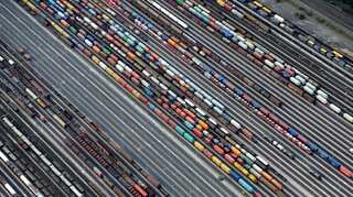 Euro zone growth, inflation outlook cut as risks from US trade grow
