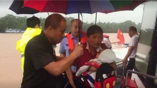 Stranded people evacuated from rain-triggered floods across China