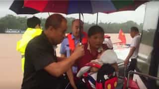 Stranded people evacuated from rain-triggered floods across China