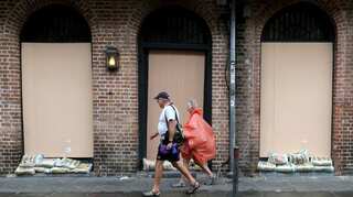 New Orleans residents huddle at home, and in bars, ahead of hurricane