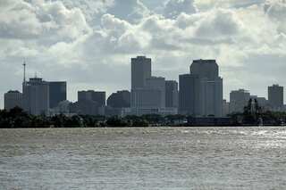 Barry churns off Louisiana, New Orleans storm surge lower than feared