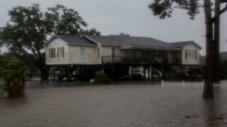 Barry weakens, but US officials warn of heavy rains, floods, tornadoes