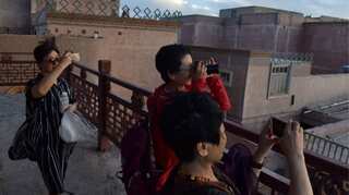 As China locks up Muslims in Xinjiang, it opens its doors to tourists