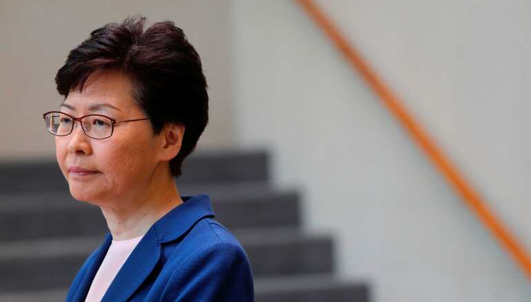 Hong Kong leader says police under extreme pressure; acknowledges 'long road' ahead