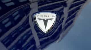 Tesla shares slide over weak profits call