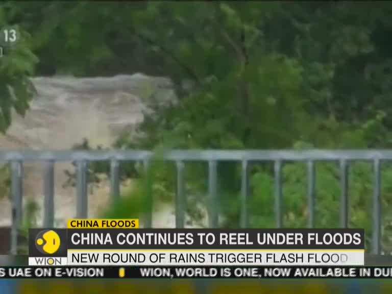 Rescuers evacuate flood-trapped people in central China city