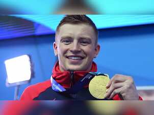 Britain's Adam Peaty completes world treble in men's 100m breaststroke