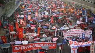 Protests rage in Philippine capital as President Rodrigo Duterte defends China relationship