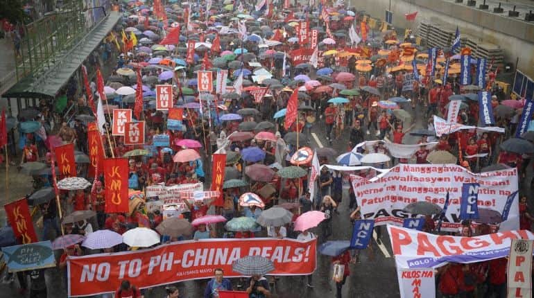 Protests rage in Philippine capital as President Rodrigo Duterte defends China relationship