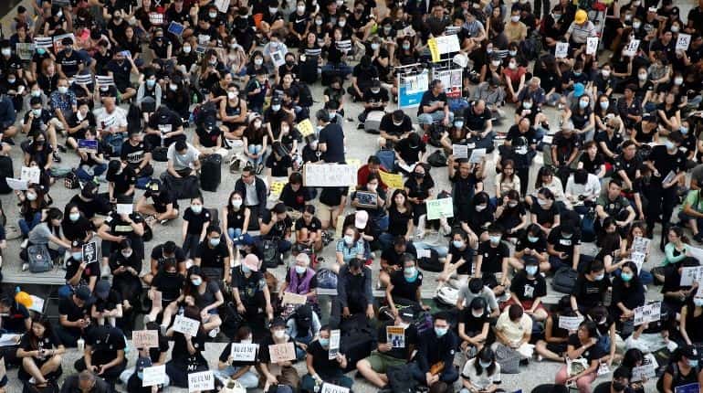 Hundred of protesters chanting 'free Hong Kong' converge on the Chinese-ruled city's airport