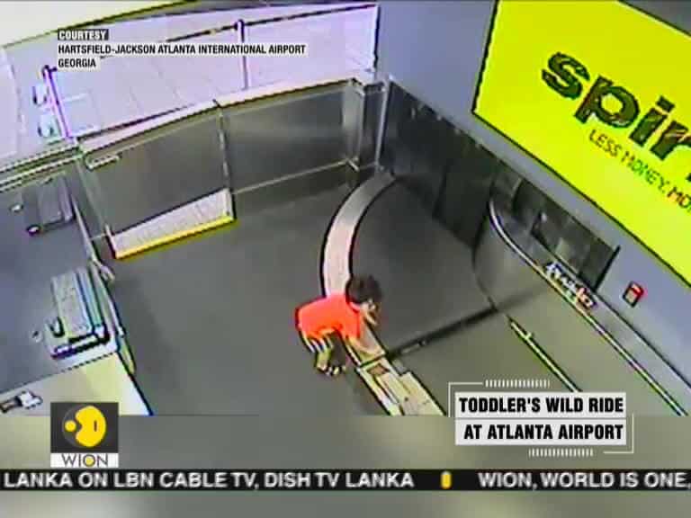Toddler takes wild ride on airport luggage belt