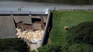 British town evacuated as dam disintegrates