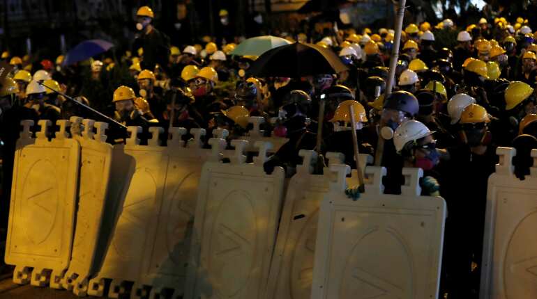 Hong Kong police fire tear gas as city is again roiled by protests