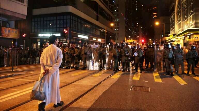 Hong Kong residents stand in support of the authorities, codemn riots